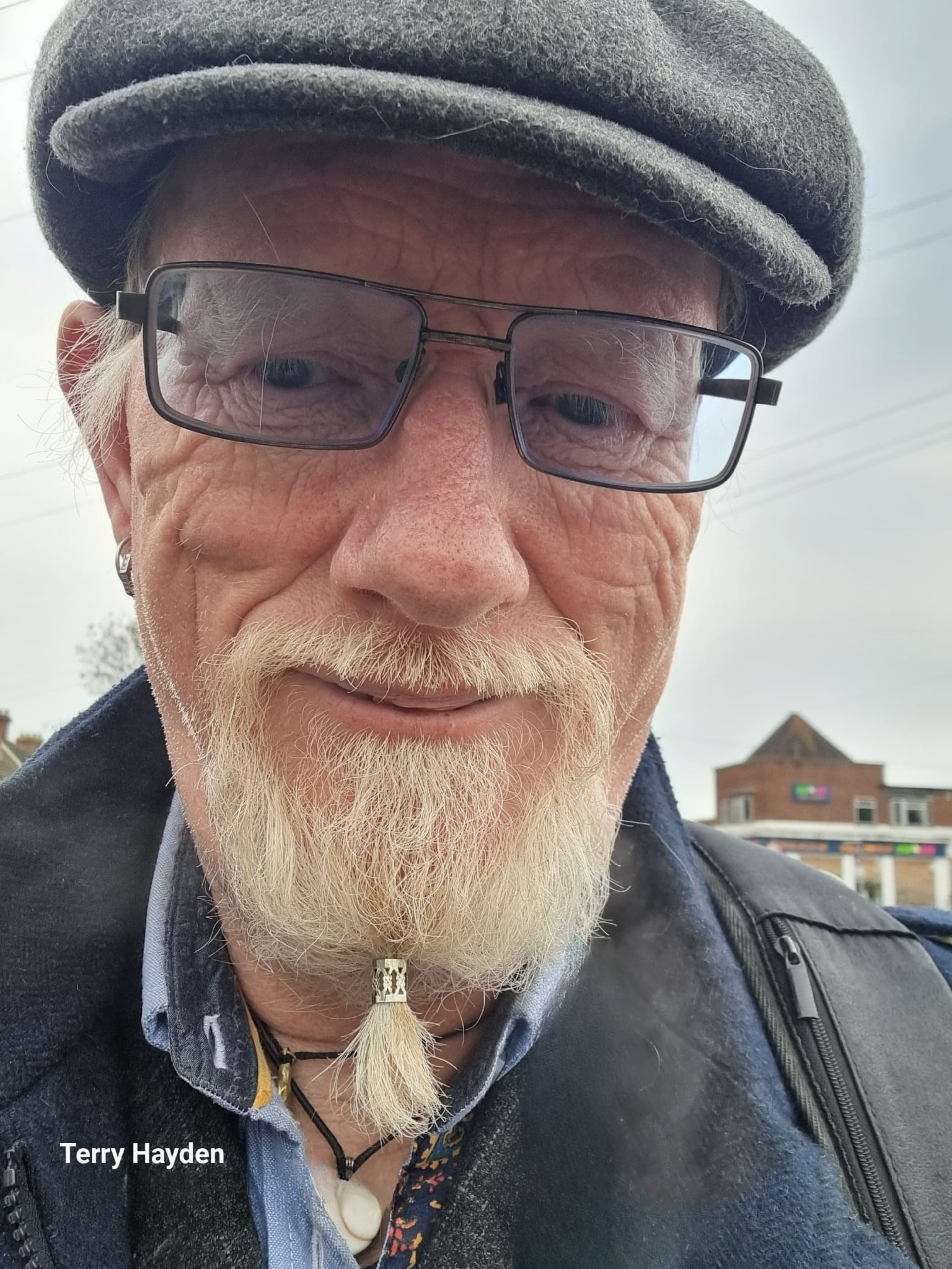 Terry Hayden, wearing his flat cap and smiling gently